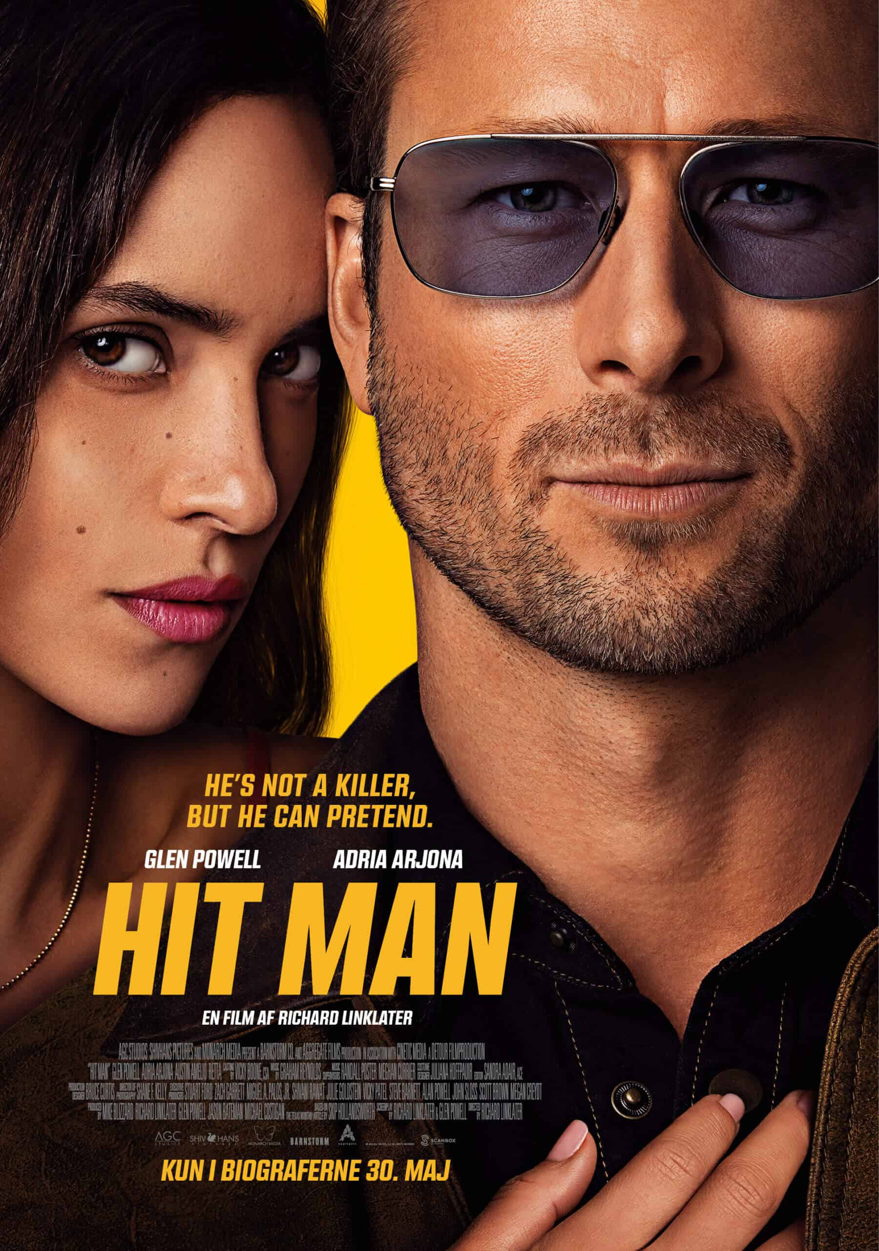 Close-up movie poster featuring a man with sunglasses and a woman with dark hair, emphasizing the film's title